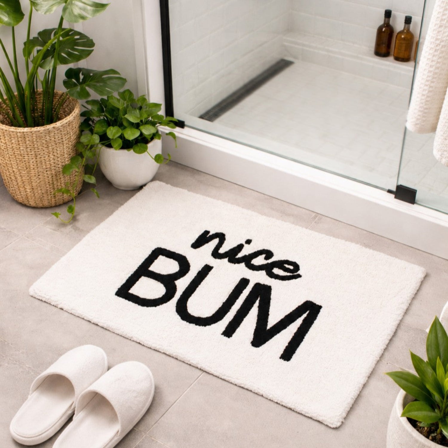Nice bum slogan bath mat. Monochrome, white and black rug for the bathroom.