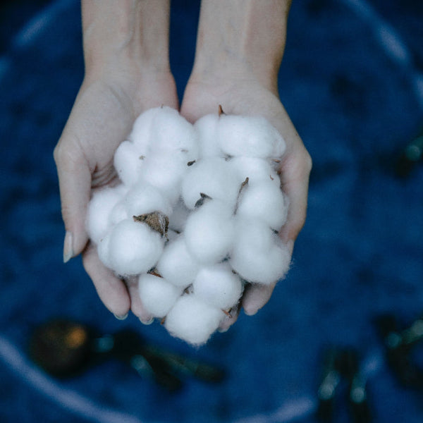 Cotton is used to make our smiley face rugs.