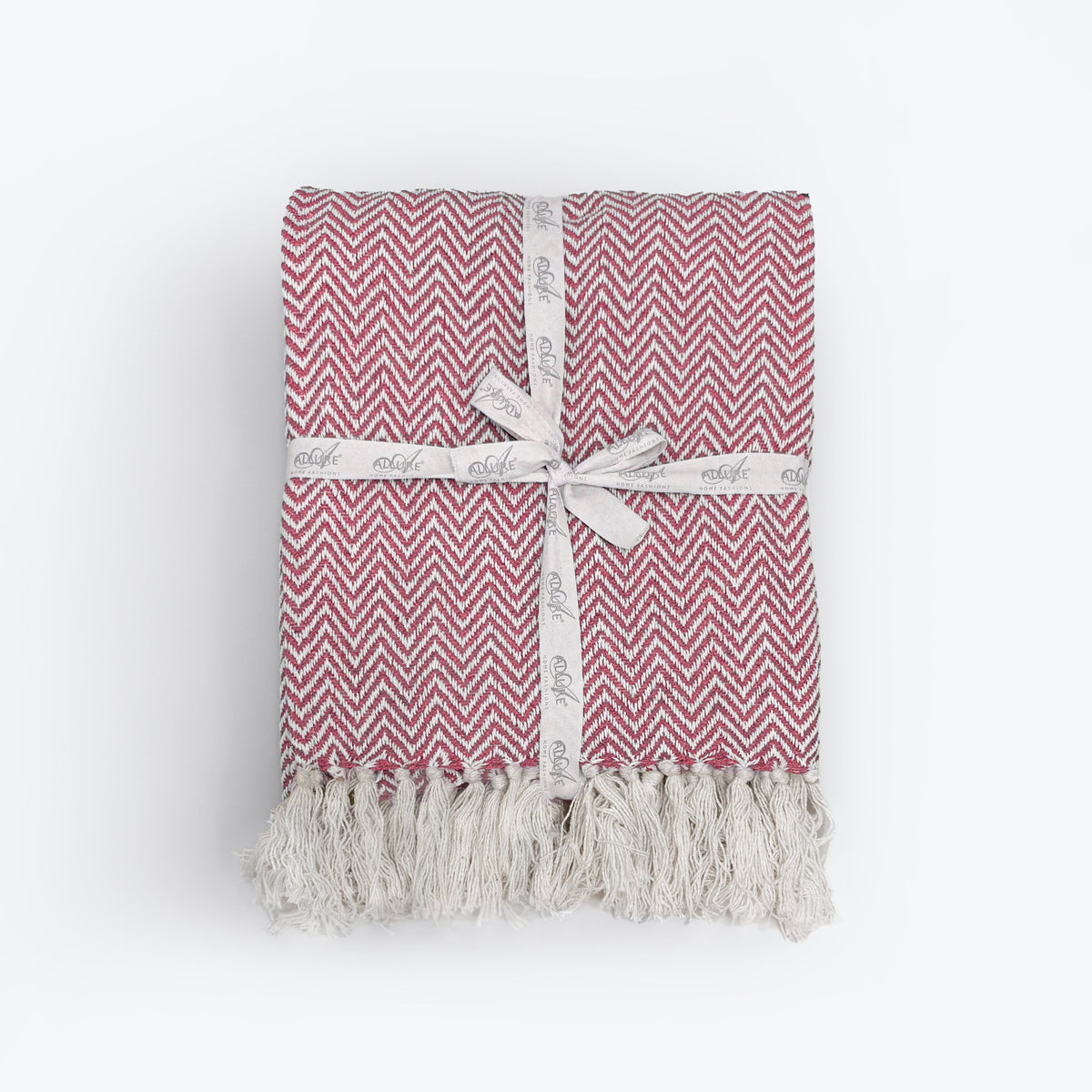 Red Audley chevron herringbone throw with tassels.