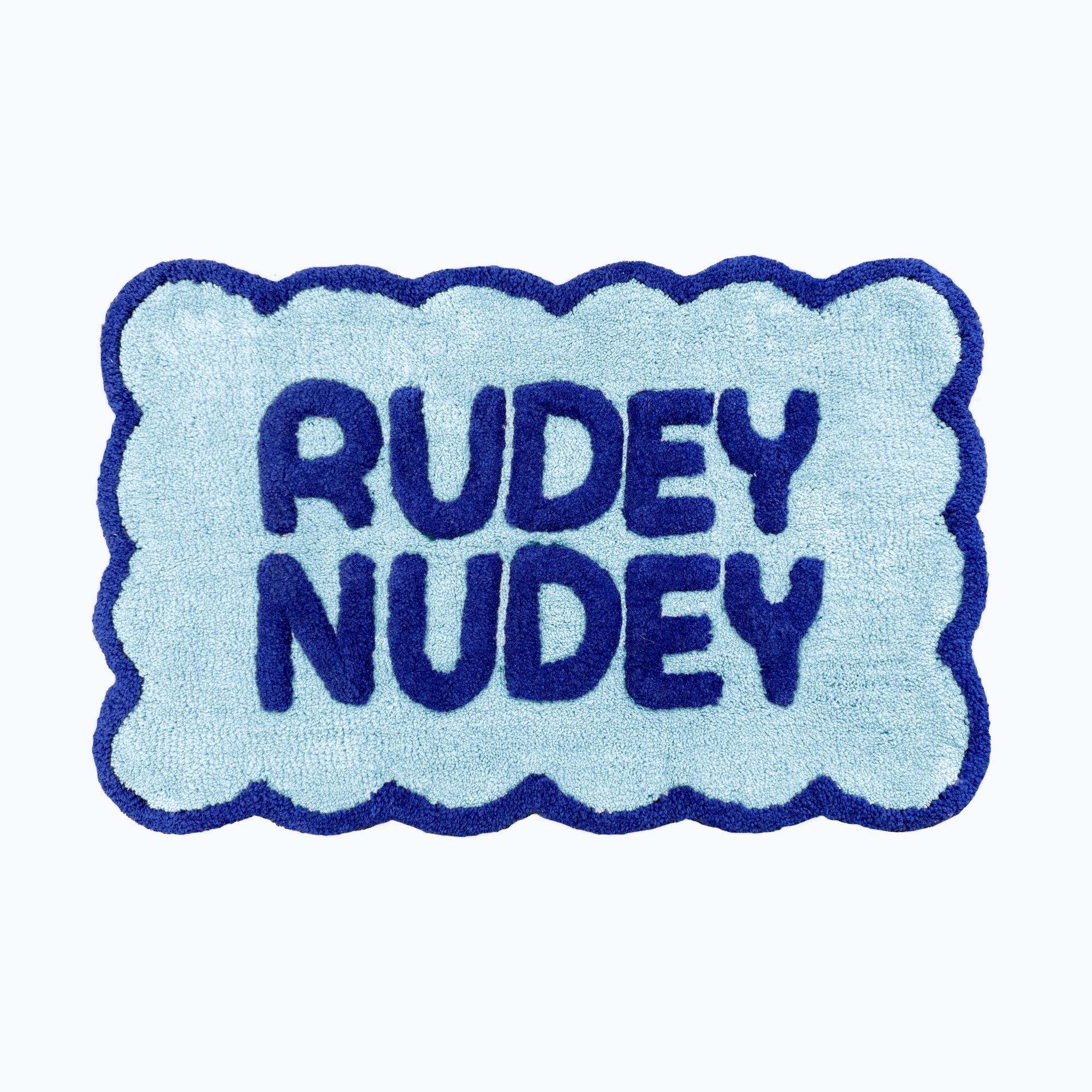 Cobalt blue and baby blue scalloped bathroom mat with rudey nudey slogan - fun dopamine bathroom.