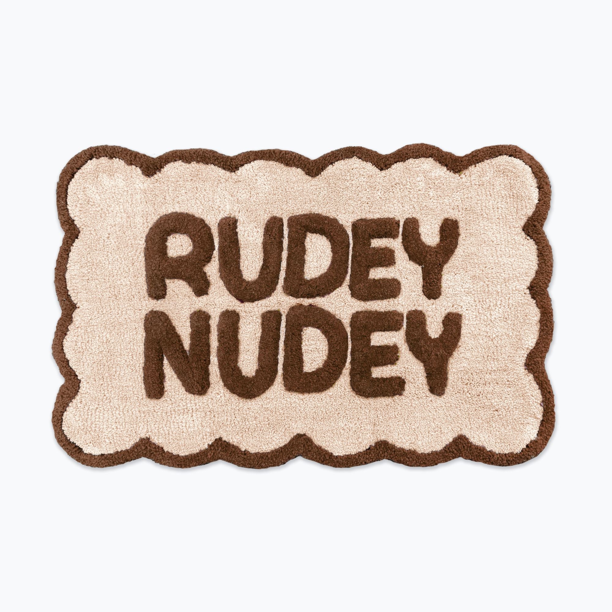 Chocolate brown and cream scalloped bath mat with slogan text - rudey nudey bathroom rug.