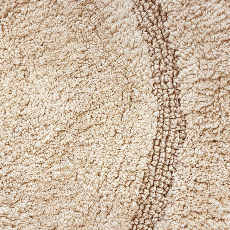 Beige neutral bath mat made from cotton - round rug.