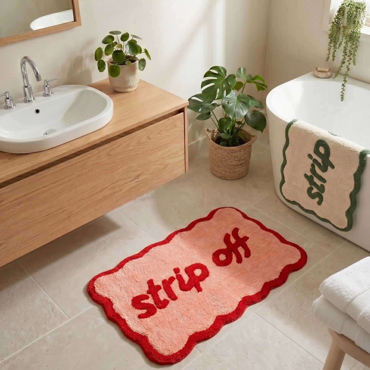 Bathroom with a red bath mat with &