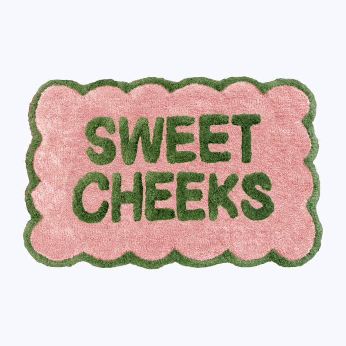 Pink and green bathroom mat with fun sweet cheeks slogan - scalloped rug.