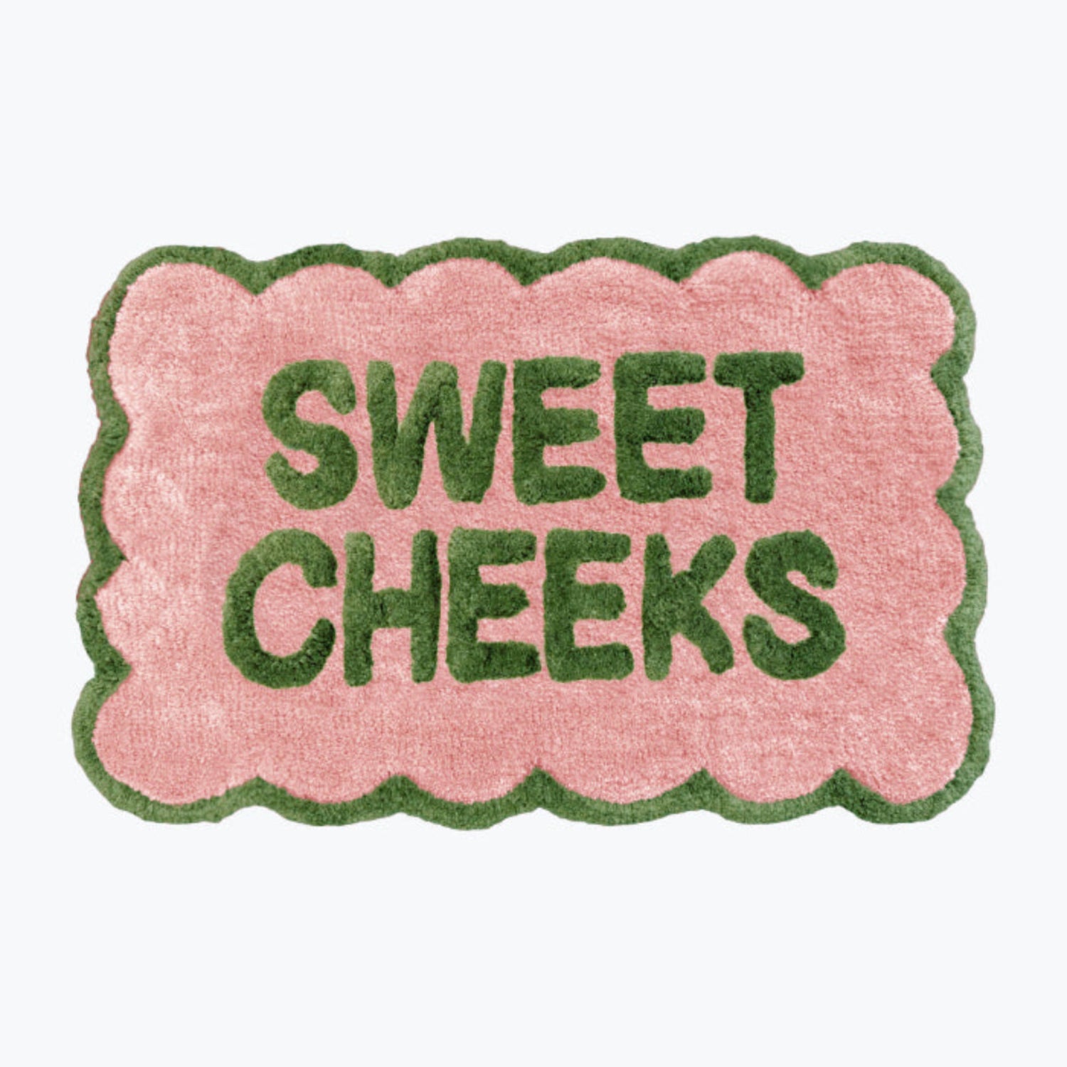 Pink and green bathroom mat with fun sweet cheeks slogan - scalloped rug.