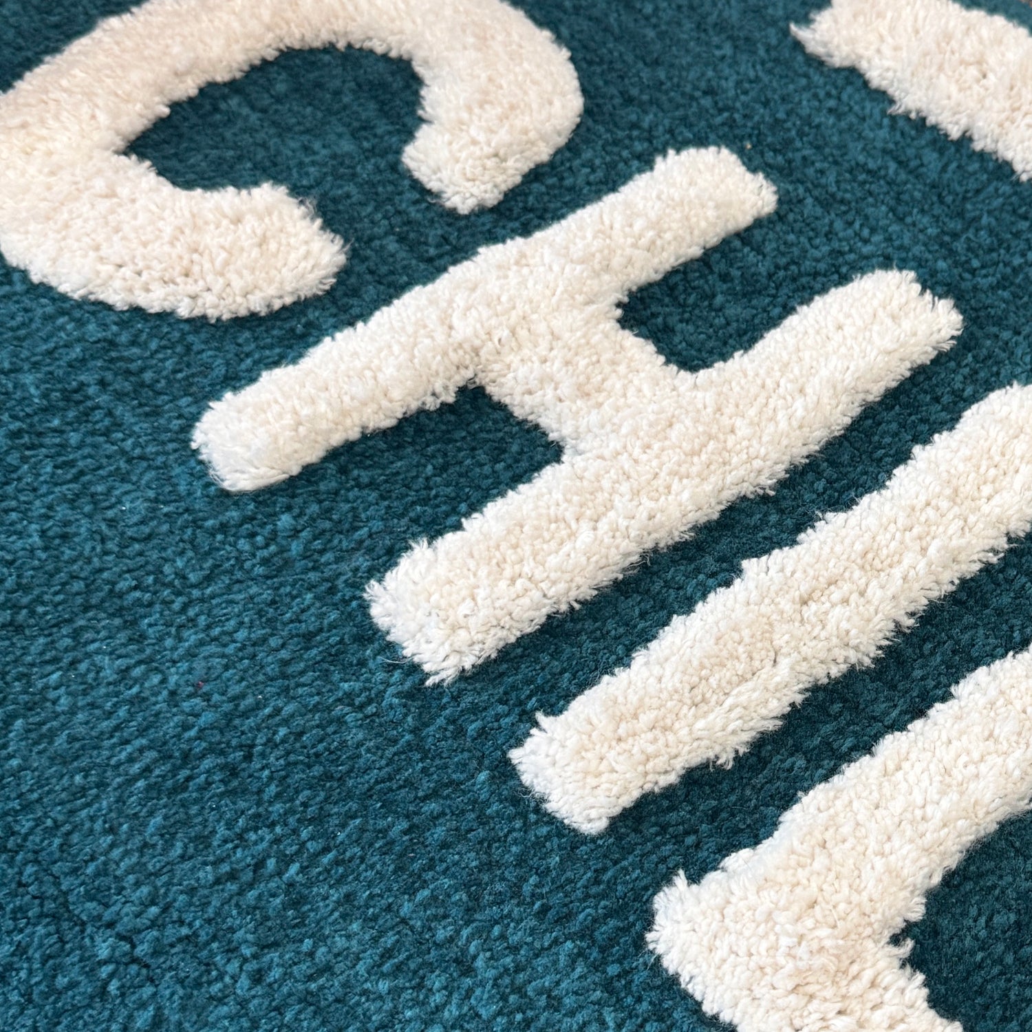 Blue statement runner rug with slogan.
