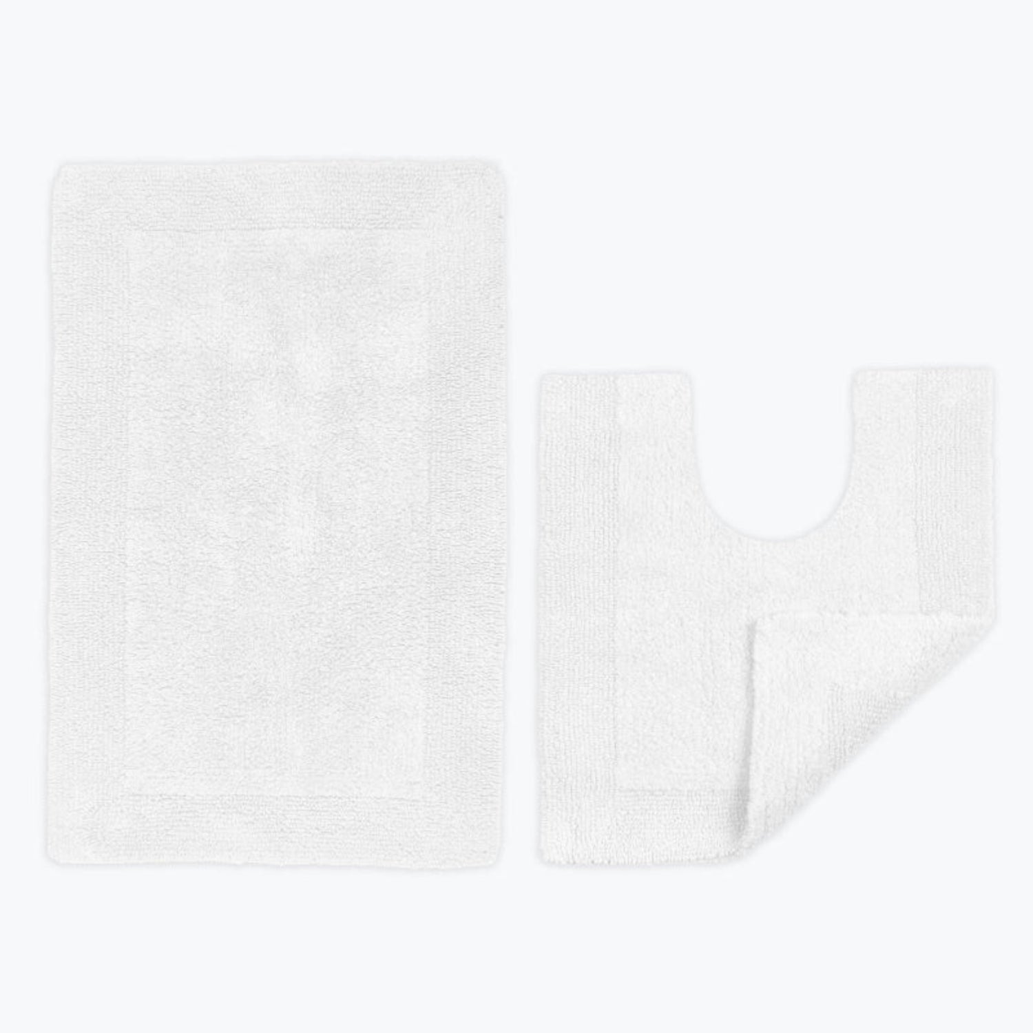 White bathroom mats 2pc set, matching bath mat and pedestal mat. 100% cotton reversible bath mats.