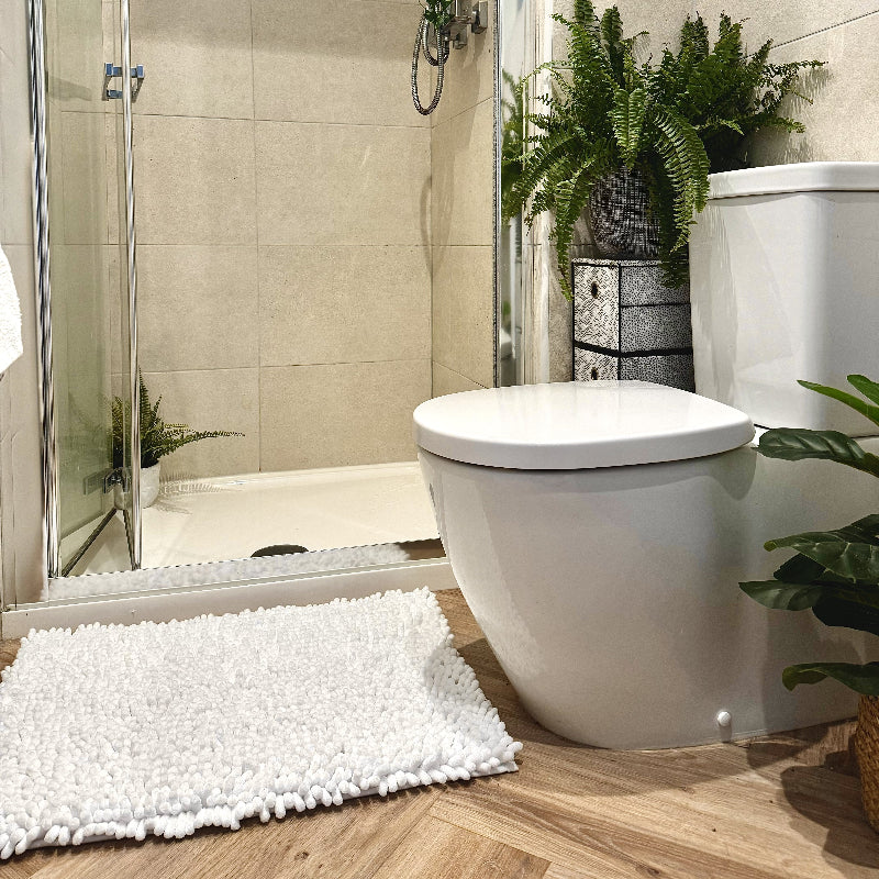 White chunky chenille non slip bath mats.