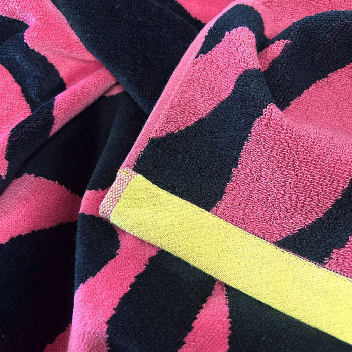 Fun pink beach towel, animal print pattern.