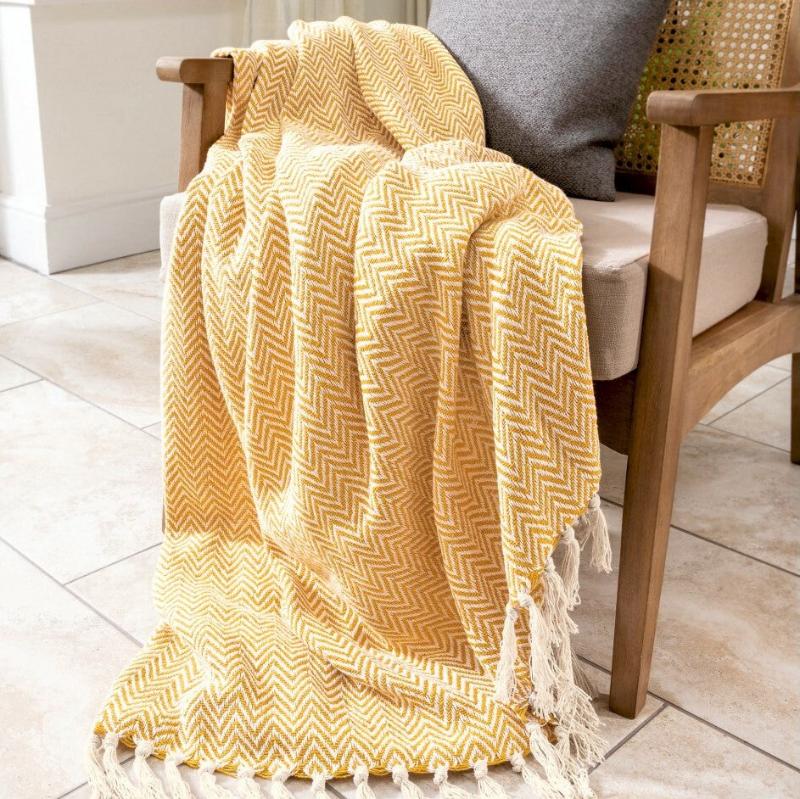 Audley herringbone chevron throw in mustard yellow.