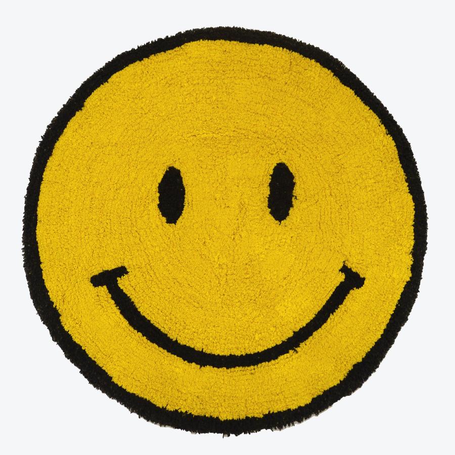 Smiley face rug - yellow happy emoji rug. Fun statement round rug for the bedroom or bathroom.