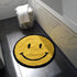 Smiley face emoji bath mat. Yellow happy fun rug, statement round shape.