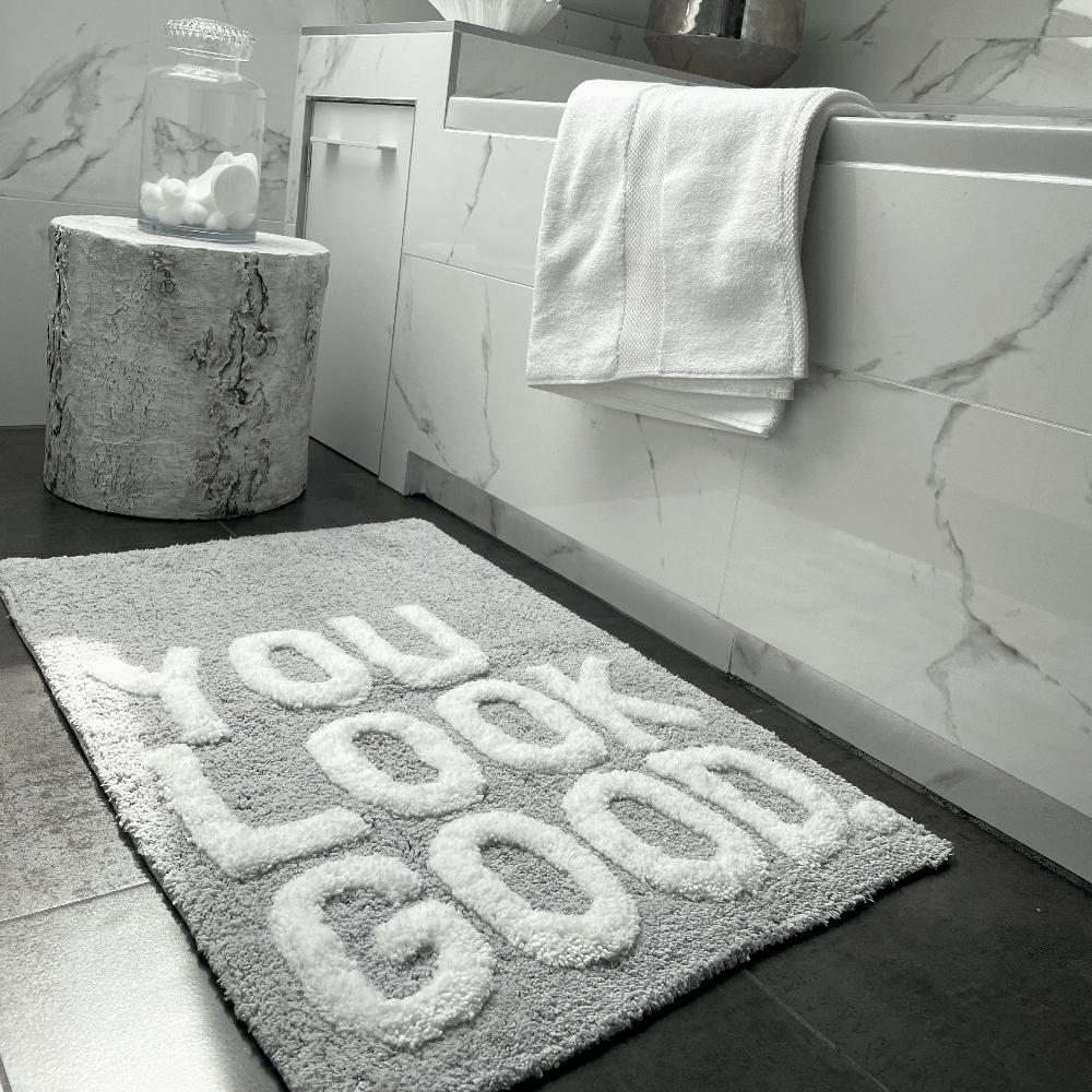 grey slogan bath mats, you look good.