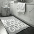 grey slogan bath mats, you look good.