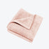 Blush pink bamboo face cloths.