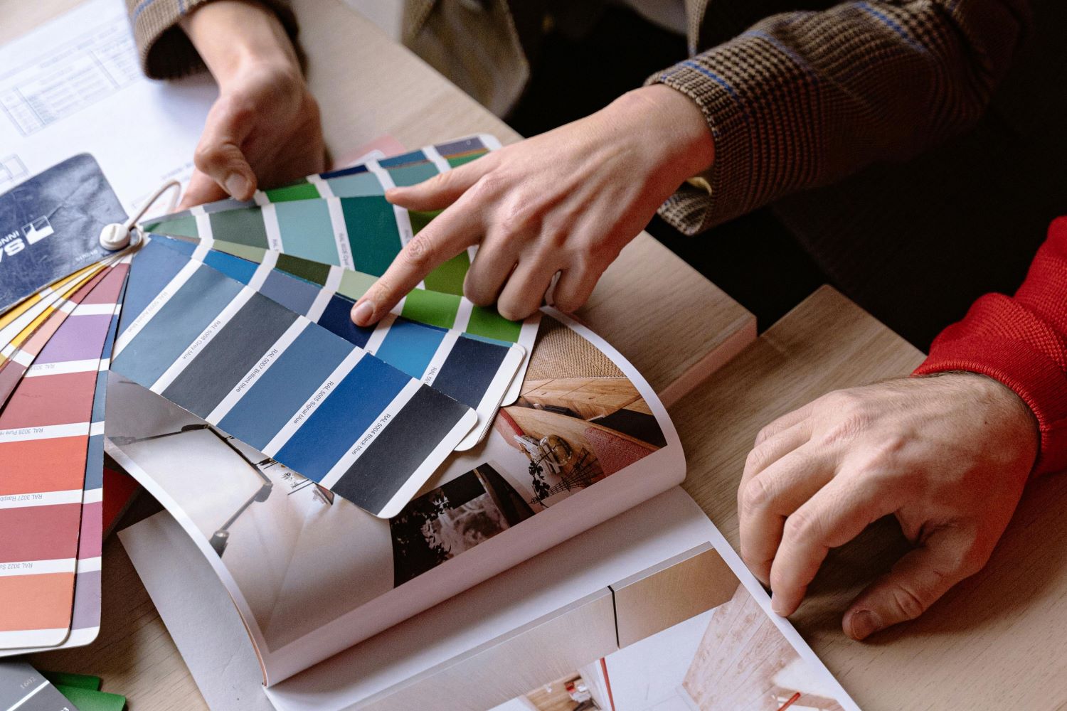 High Angle View of Men Discussing Colours for an Interior Project
