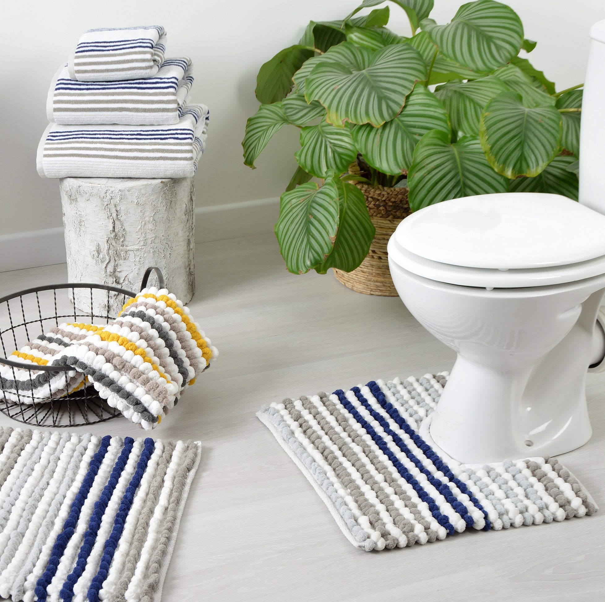 Pedestal mats and toilet mats for the bathroom.