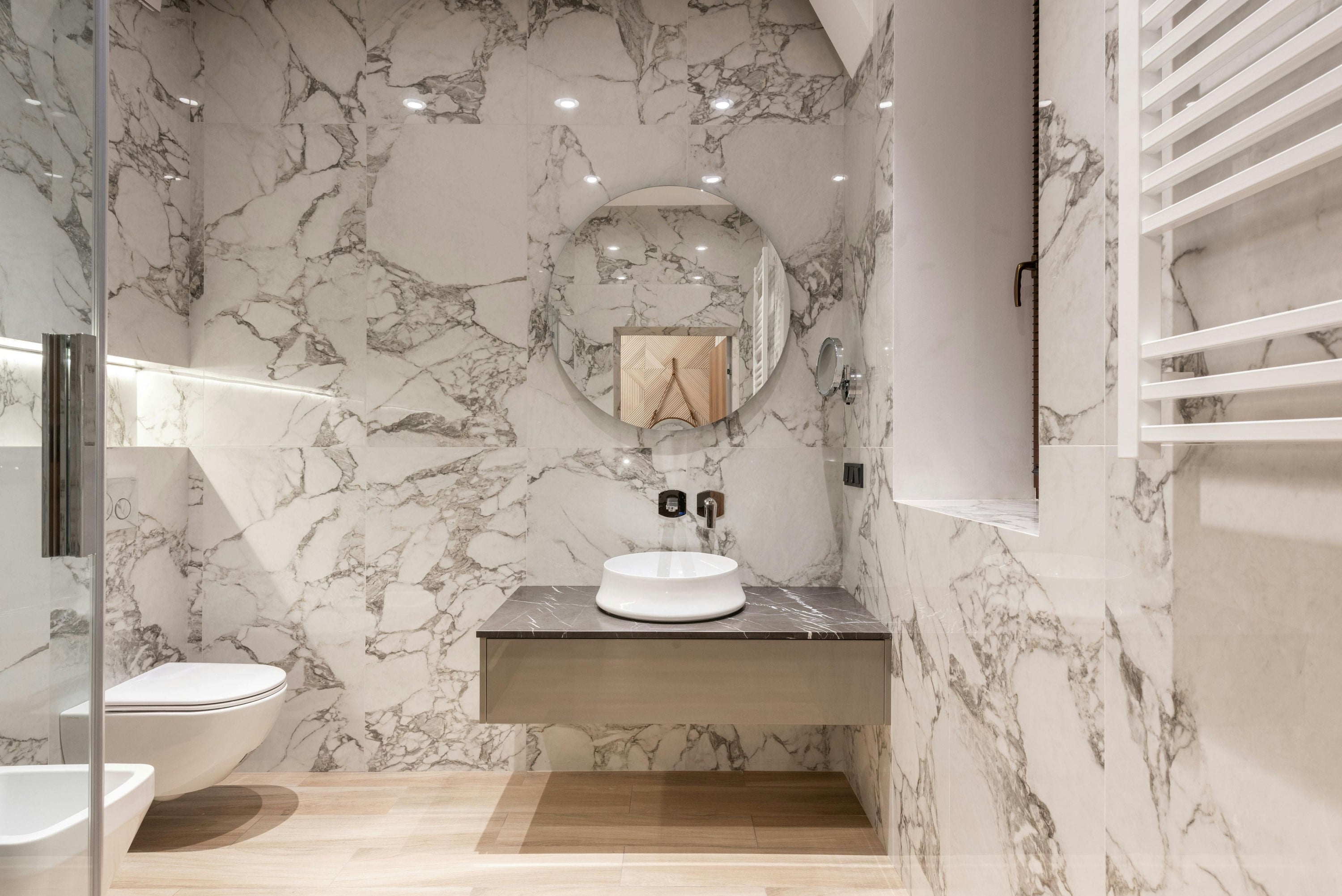 White and black marble bathroom tiles.