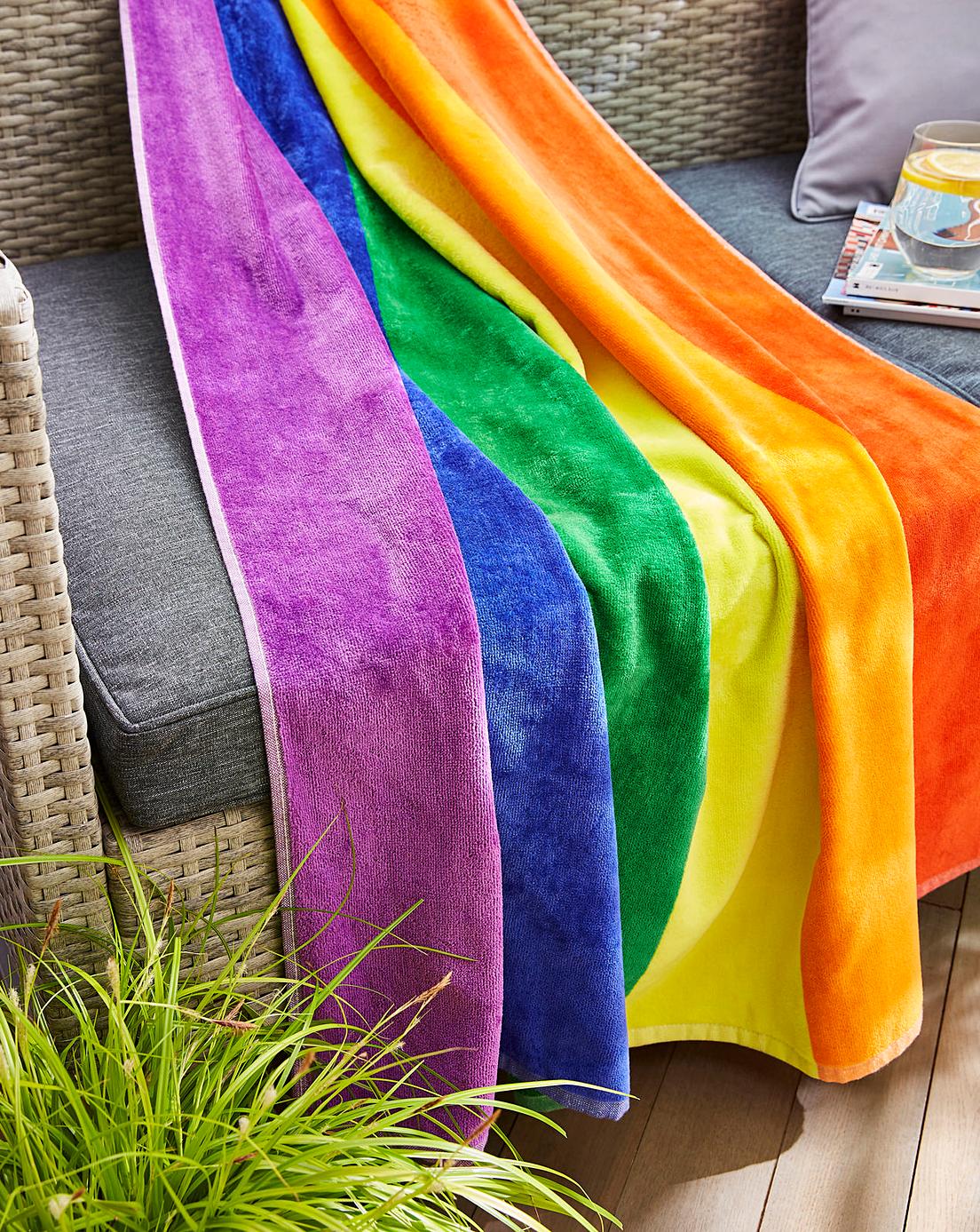 Large Rainbow Stripe Beach Towel on Sofa
