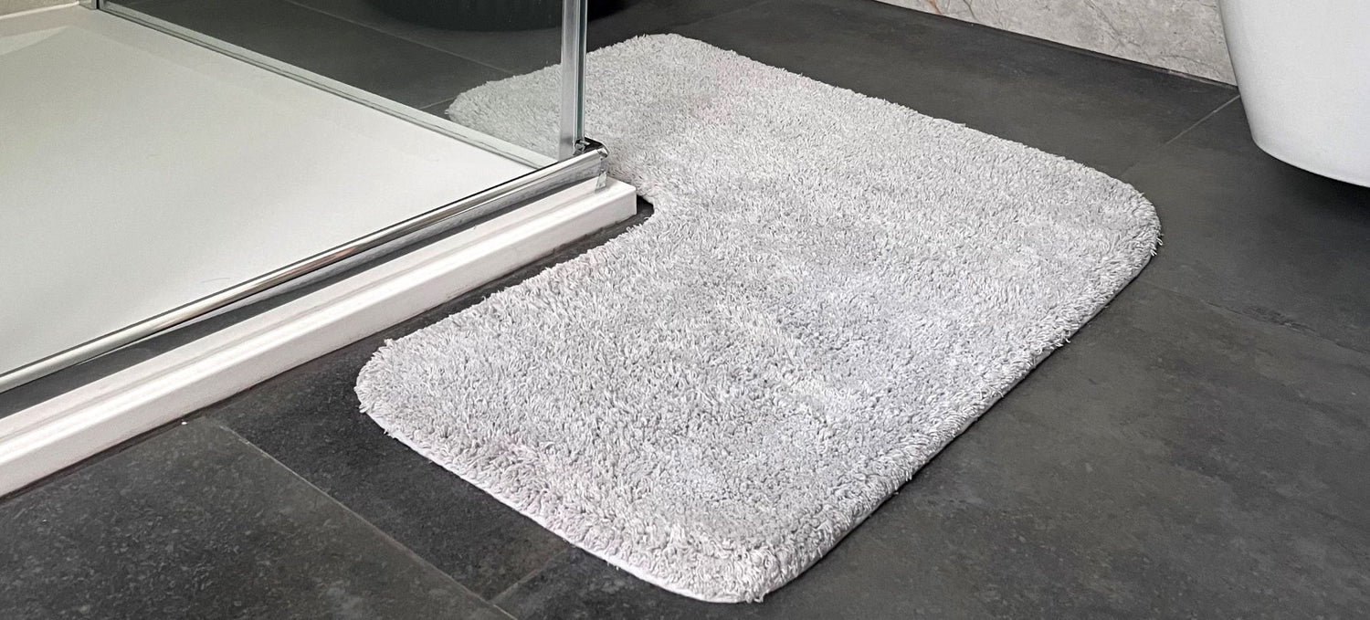 Corner bath mat for shower units. Thick rugs for the bathroom in small size.
