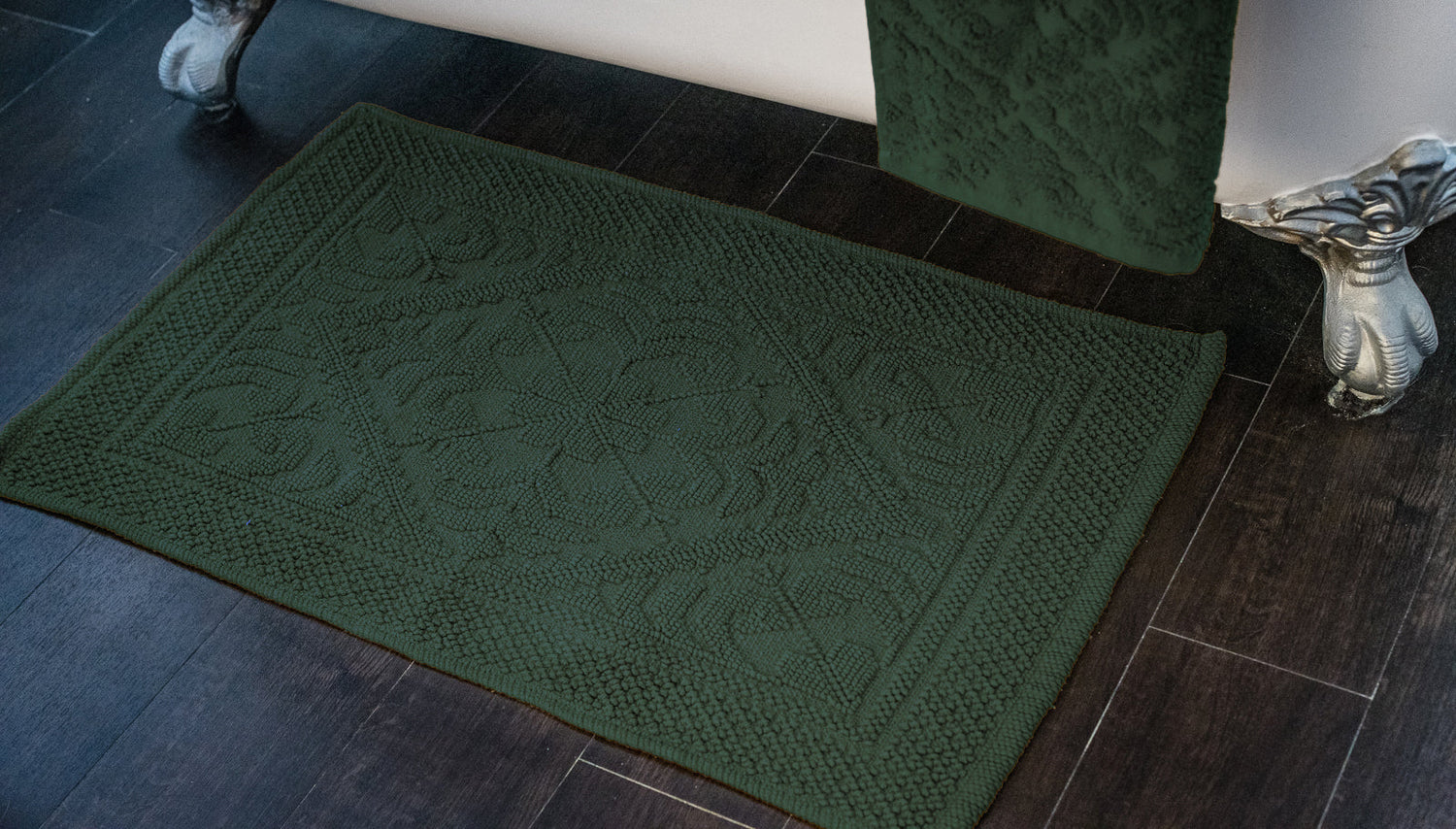 Green bath mats. Sage green and dark green bath mats for the bathroom.