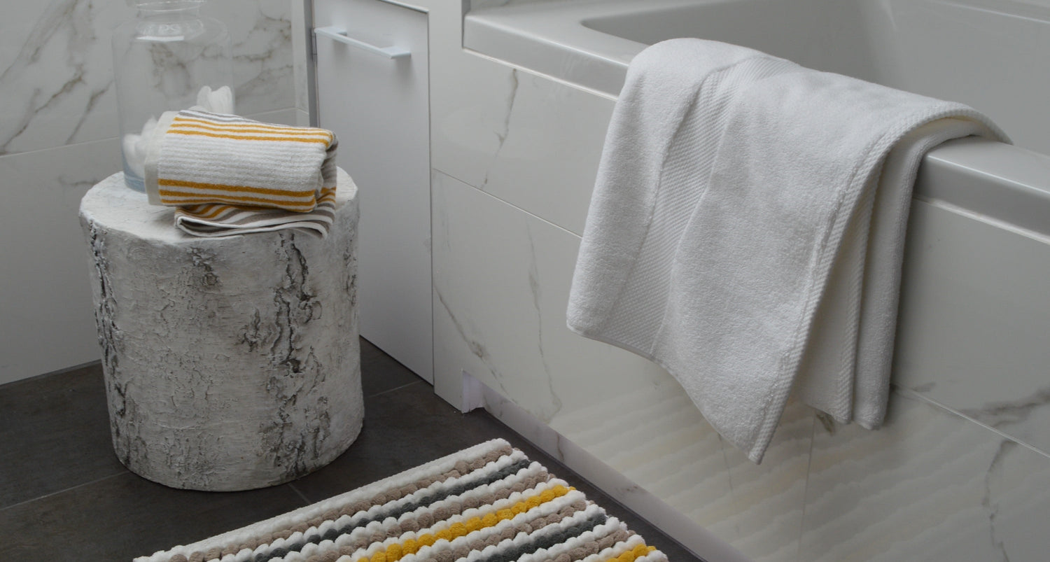 Yellow towels. Hand towels, bath towels and bath sheets in yellow colour. Made from 100% cotton.