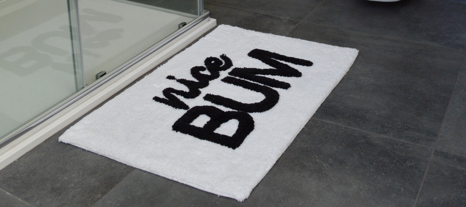 slogan bath mat with &