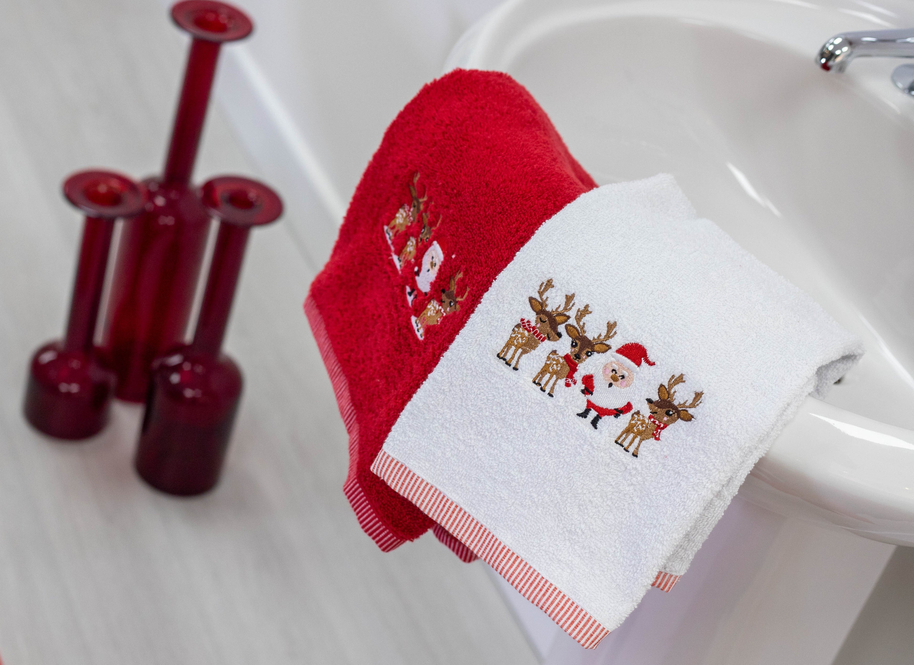 christmas hand towels on a sink