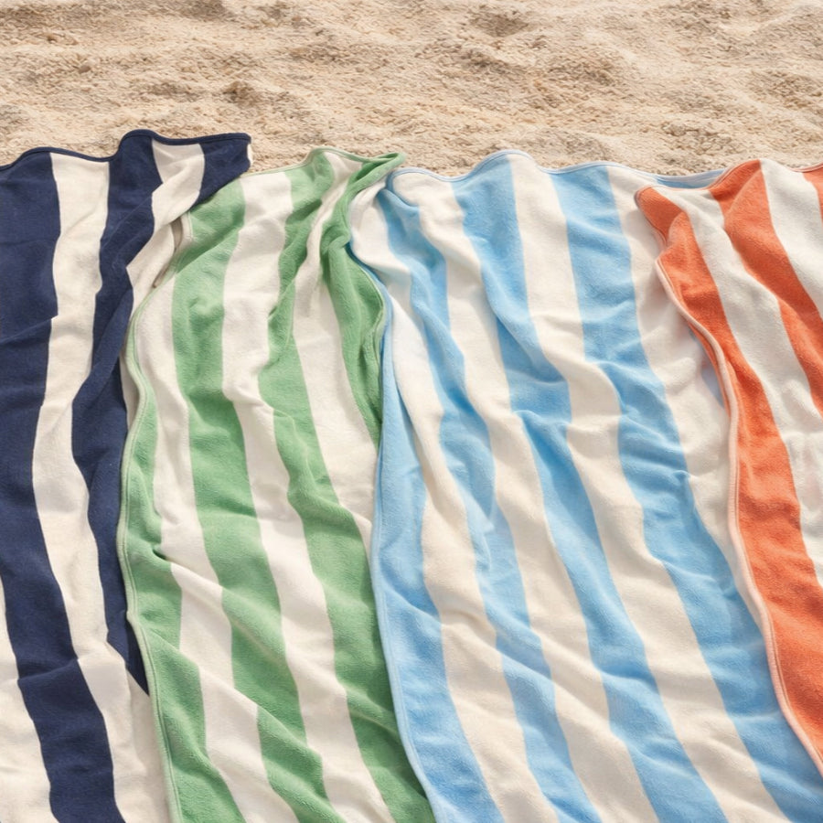 Collection of large striped beach towels with scalloped edging, made from 100% cotton in fun statement colours.