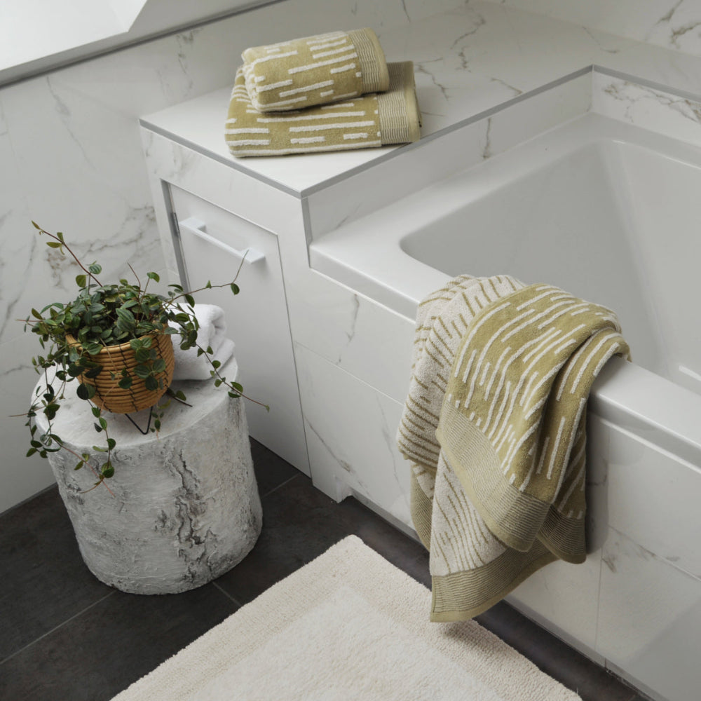 Green patterned stripe towels in three sizes.