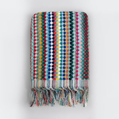 Striped colourful bath towel with textured bobble design and tasselled fringe.