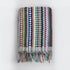 Striped colourful bath towel with textured bobble design and tasselled fringe.