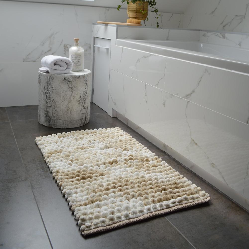 Beige bathmats. Luxury bobble bath mat with chunky deep pile.