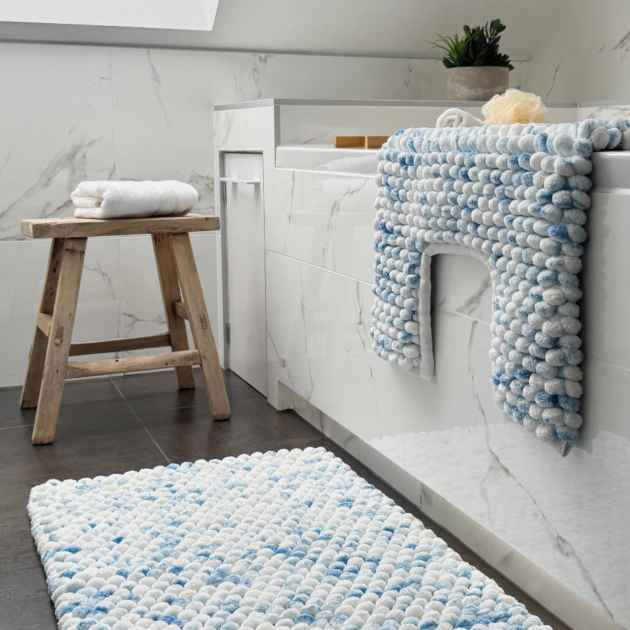 White and blue toilet mat in a marble pattern - thick deep pile design.