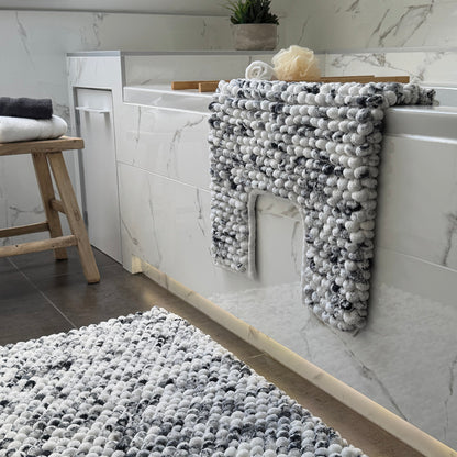 Grey and white U shape toilet mat in marble pattern, for the bathroom or en suite.