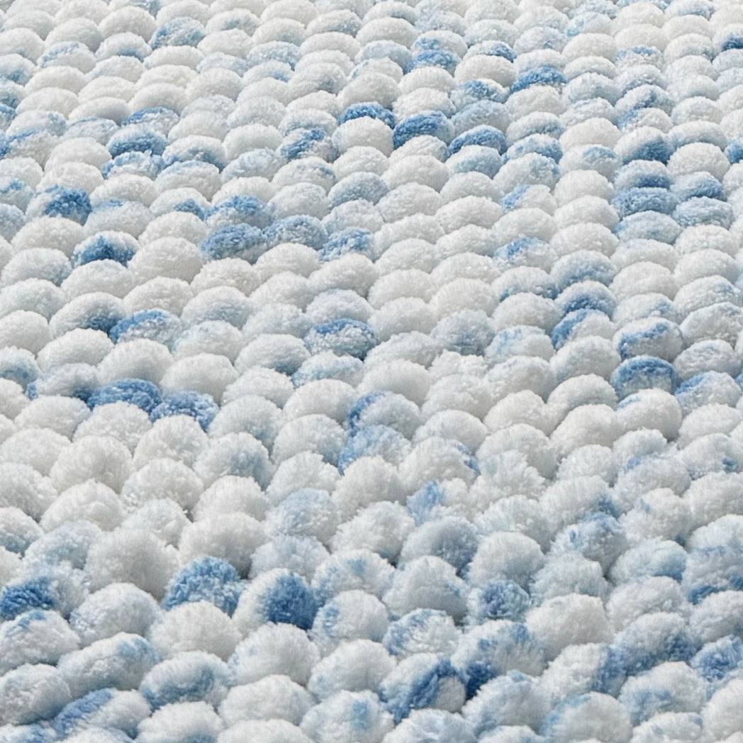 Sky blue bathroom mats in a handwoven chunky bobble pile.