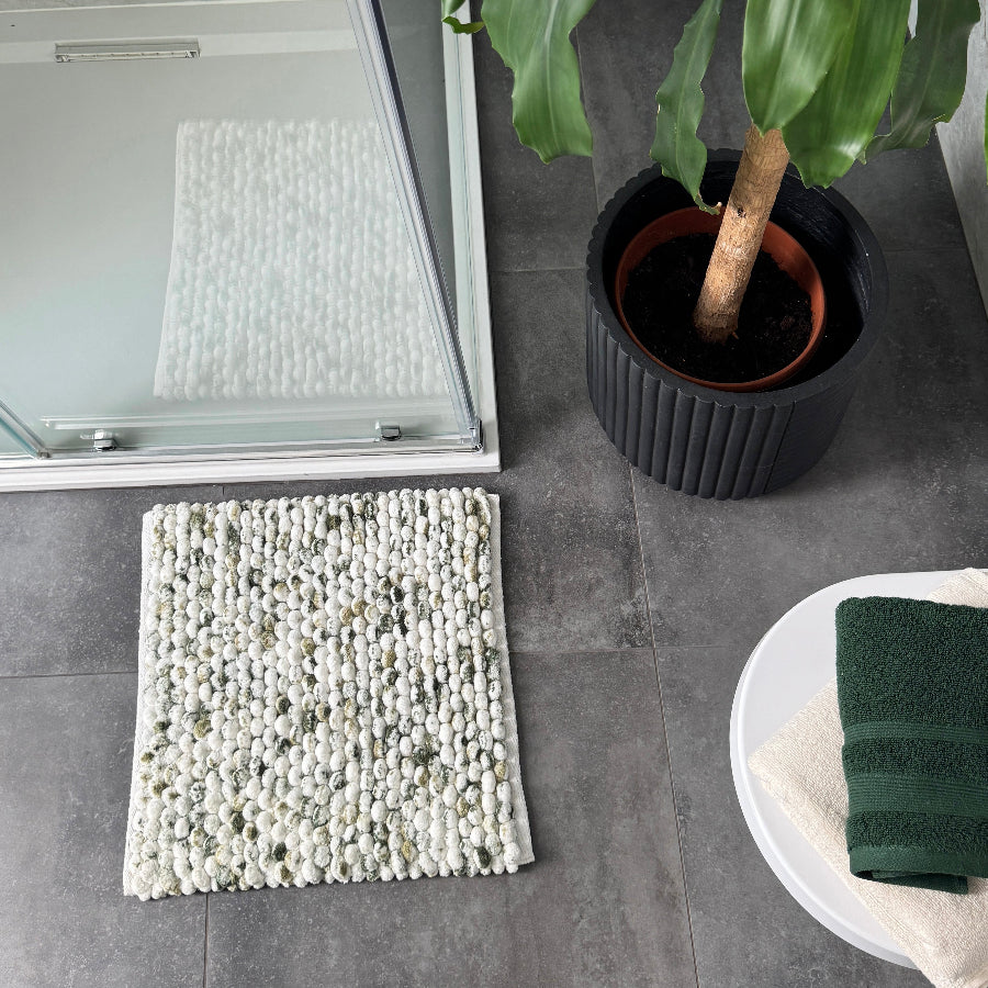 Textured bobble bath mat in a white and green marble pattern - square shaped bath mat for small bathrooms.