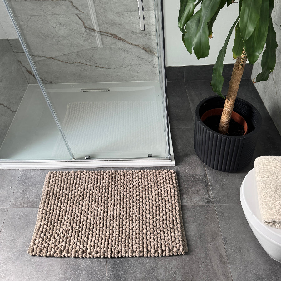 Brown bathroom rugs with thick chunky bobbles - handwoven bath mats.