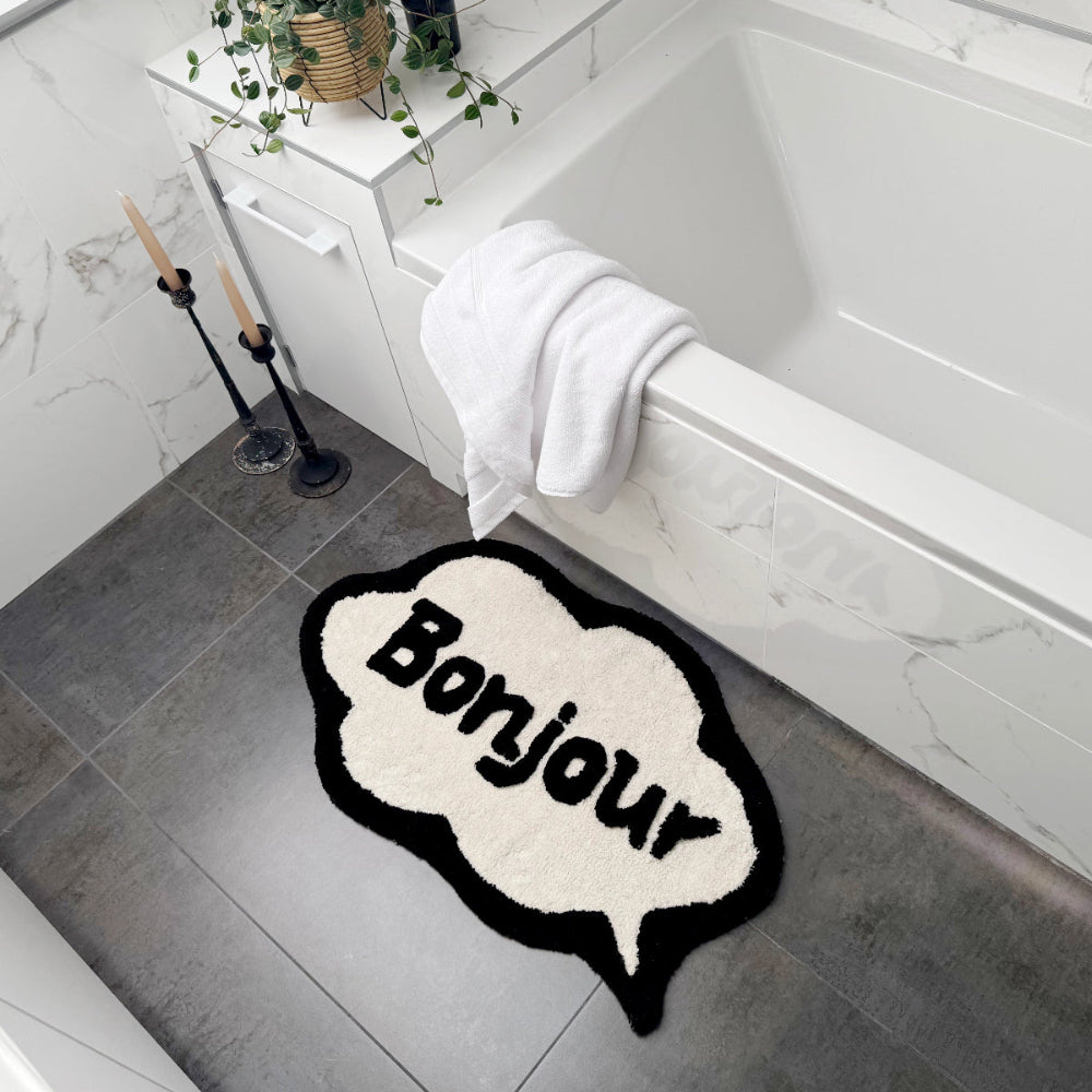 Black and white Bonjour slogan bath mat.