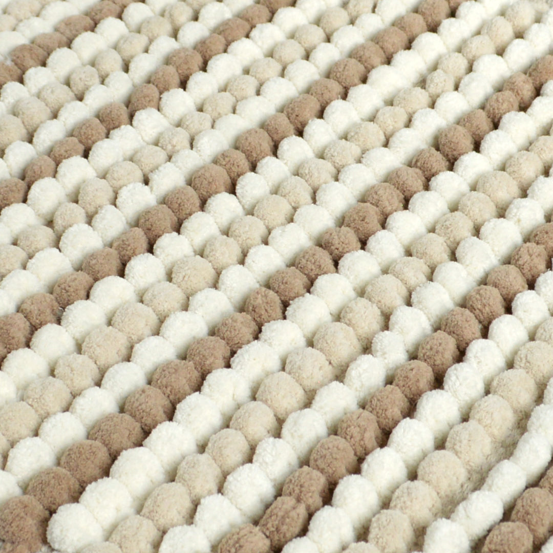 close up of chunky bobble pedestal mat in beige