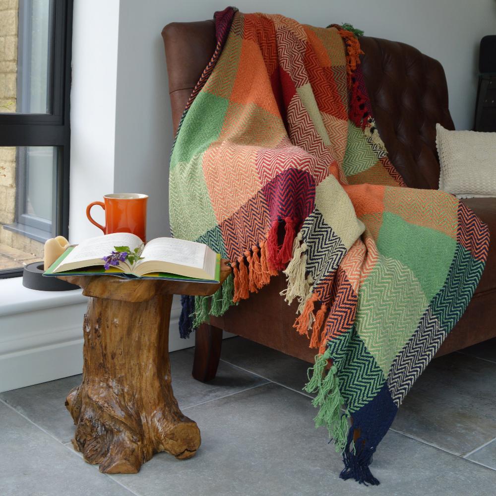 Check multicolour herringbone throw blanket in orange, navy and green colours.
