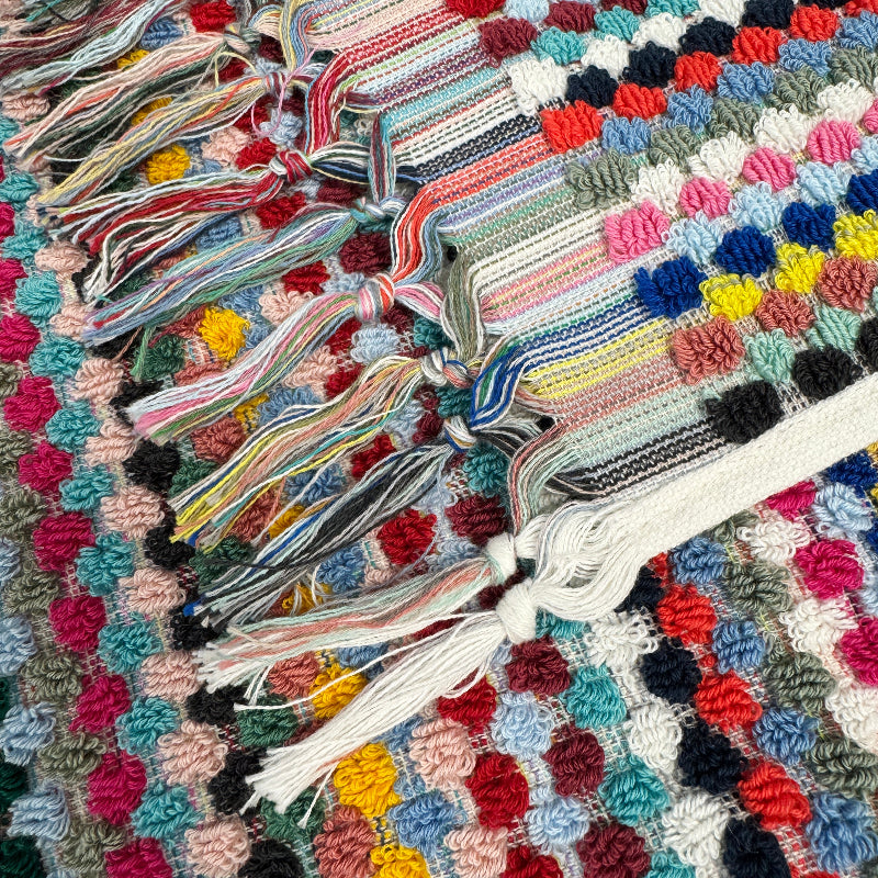 Fun patterned towels with tassels for a statement design in your bathroom.