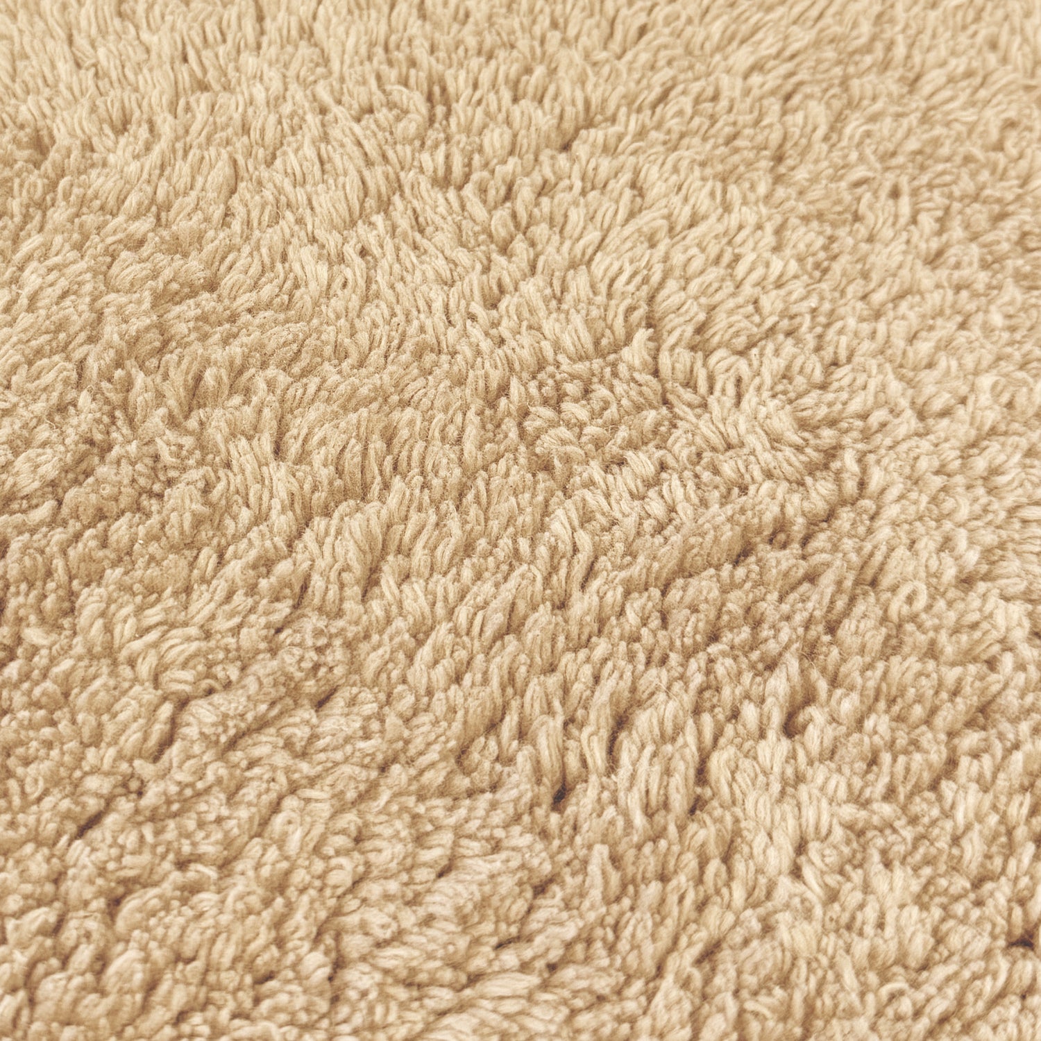Beige cotton bath mat close up - 100% cotton.