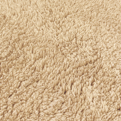 Beige cotton bath mat close up - 100% cotton.