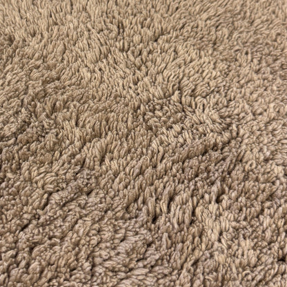 Close up of brown cotton bath mat.