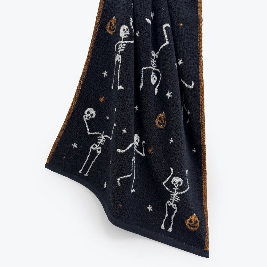 Black and white skeleton hand towels with fun pumpkins. Halloween pumpkin decor.