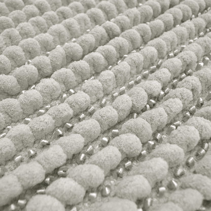 Light grey toilet mat in thick chunky bobble style.