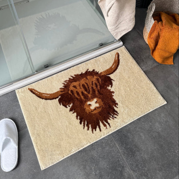 Neutral Highland Cow bath mat with non slip backing.
