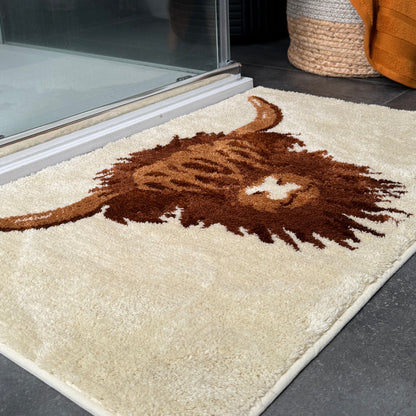 Fluffy highland cow bath mat in cream neutral colours. Super soft rug for the bathroom.