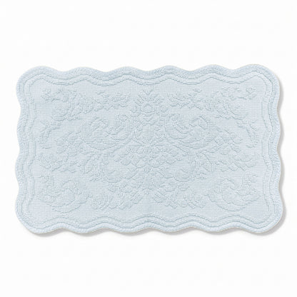 Scalloped bath mat in baby blue colour, with floral texture design - made from 100% cotton.